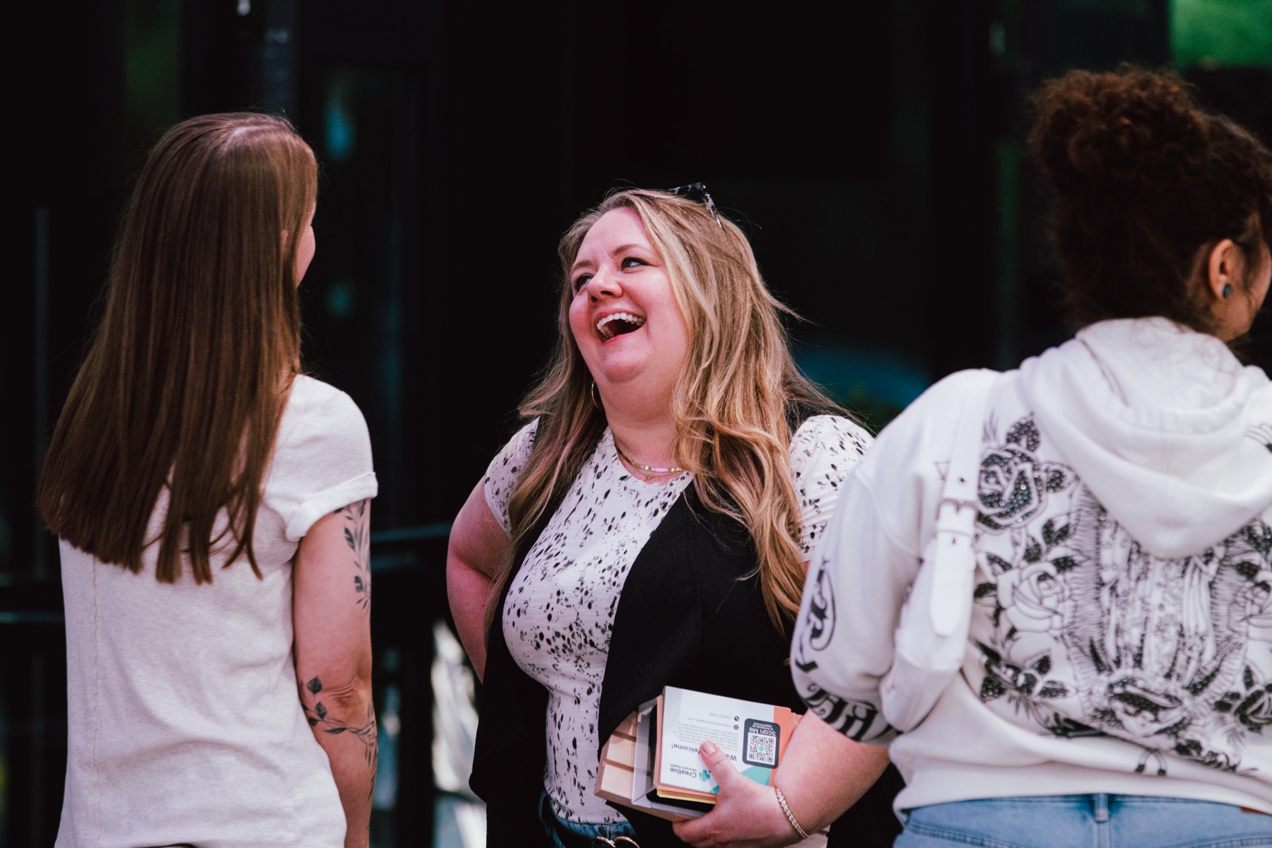 Women laughing together at the conference